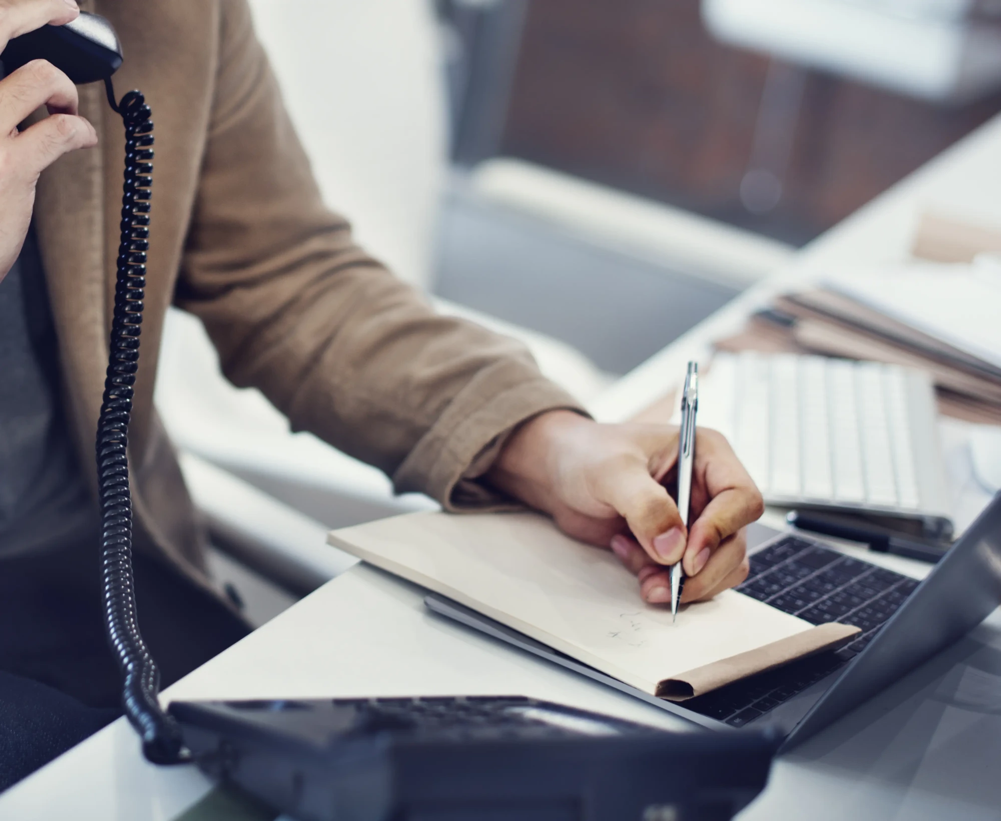 closeup-hand-writing-note-while-phone