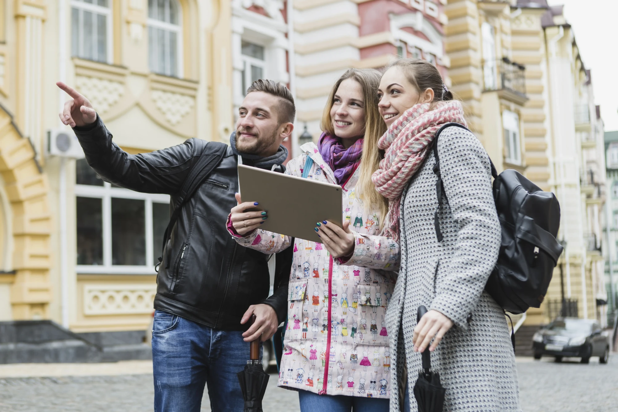 cheerful-friends-with-tablet-street