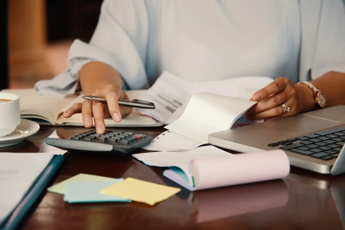 entrepreneur-working-with-bills-scaled (1)