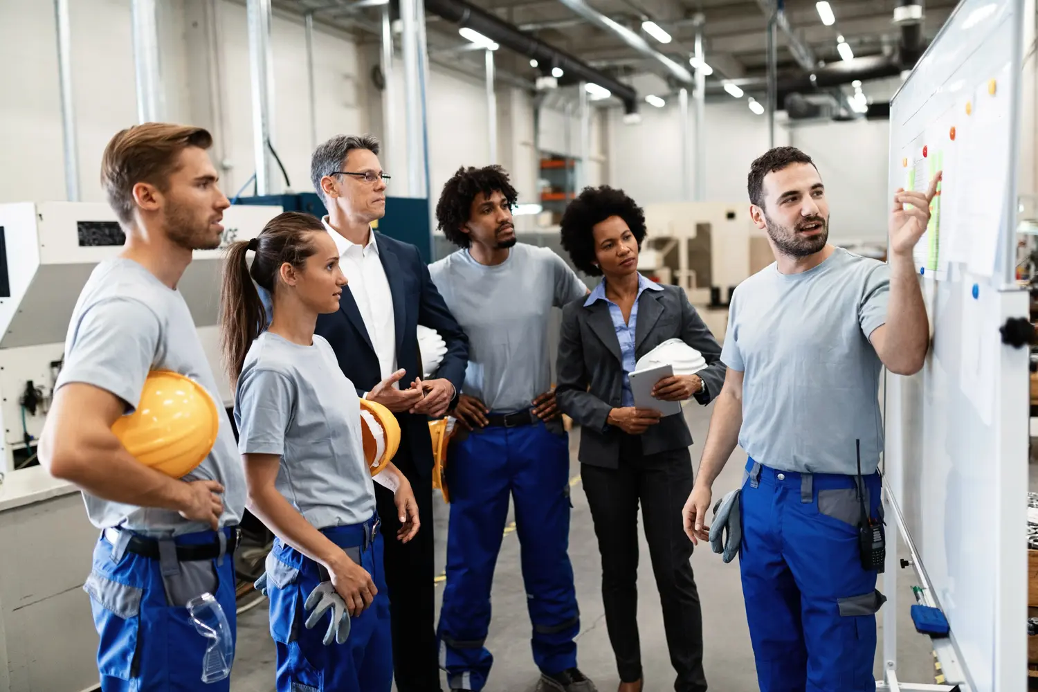 happy-manual-worker-presenting-results-business-development-while-giving-presentation-company-leader (1)